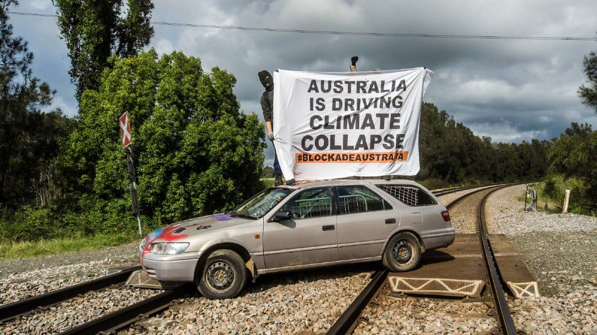 CLIMATE PROTEST: Activist group Blockade Australia released photographs of a man using a vehicle to block a coal train line in the Hunter region on Tuesday, November 9 2021. Picture: Blockade Australia Facebook.