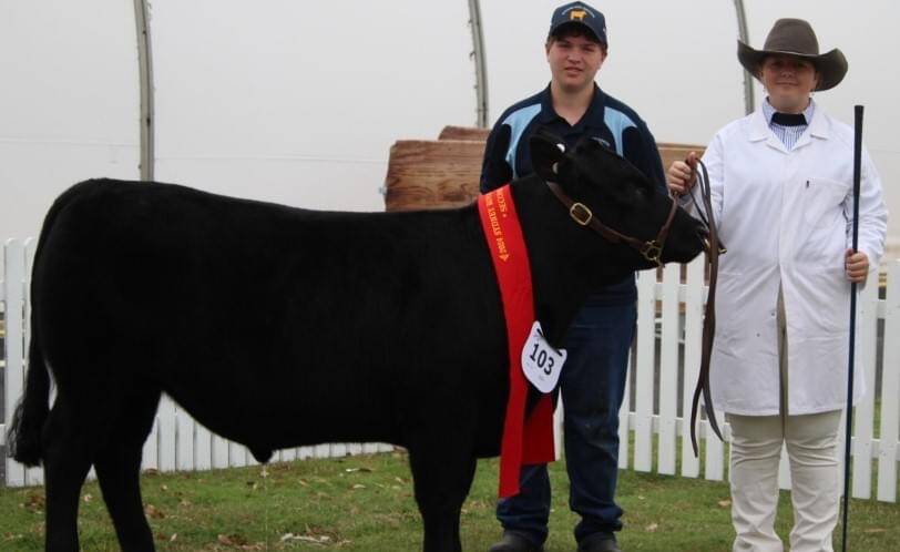 The grand champion school carcase was awarded to Scone High School for their Angus steer bred by BW and MM Brooker, Rouchel, pictured with students Ryan Davidson and Brooke Sampson. Picture supplied.