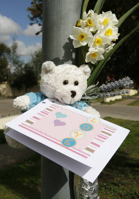 TRIBUTE: A teddy and card left at the scene of the incident in 2007. 