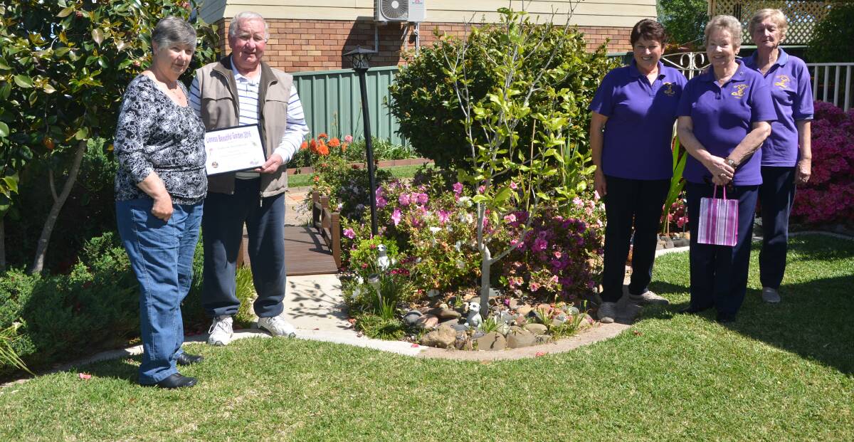 MAGNIFICENT: Eunice and Tony Johnston, with Muswellbrook Lionesses Betty Eriksson, Nancy Bullard and Bev Farrell, in front of the couple’s beautiful garden.