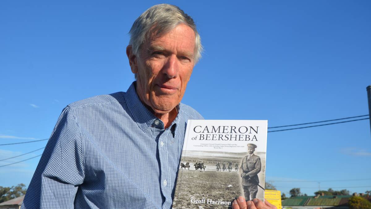 PROUD: Author Geoff Harrison, from Soldiers Point, with a copy of his latest book, Cameron of Beersheba.