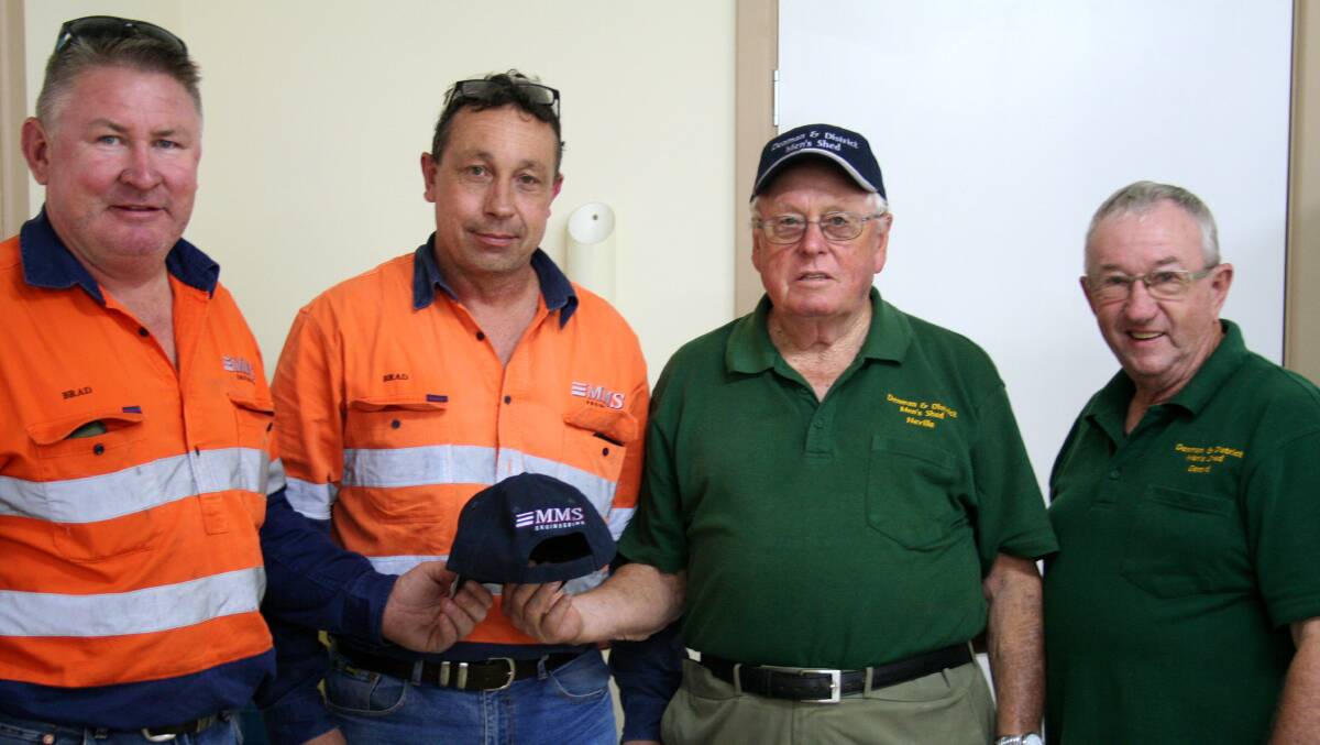 Brad Collins and Brad Smith present new caps to Neville Bray and Gerard Minch. Pic: DENIS CHANDLER