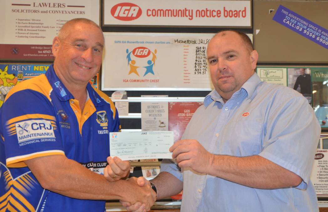 WITH THANKS: Muswellbrook District Junior Rugby League Football Club president Chris Dengate receives a $1500 cheque from IGA Muswellbrook manager Leon Quirk.