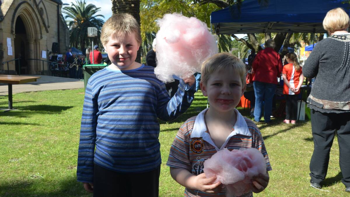 SWEET TOOTHS: Nine-year-old William and James Jensen-Paag, 4, found the fairy floss to their liking at the St Alban’s Spring Fair on Saturday.