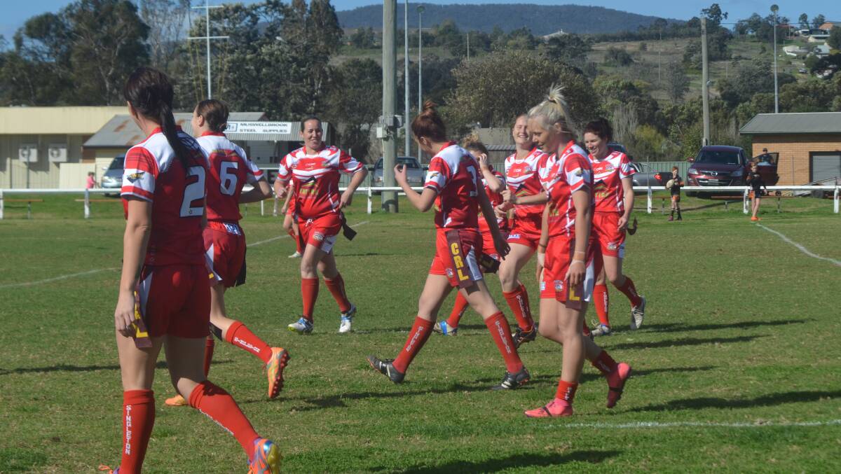 TRY TIME: Singleton’s women’s league tag side celebrates Tamika Chesworth’s four-pointer against Aberdeen at McKinnon Field on Saturday. 