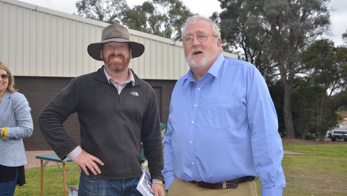 RELAXED: Candidates Martin Rush and Rod Scoles at the Muswellbrook Indoor Sports Centre on Saturday.