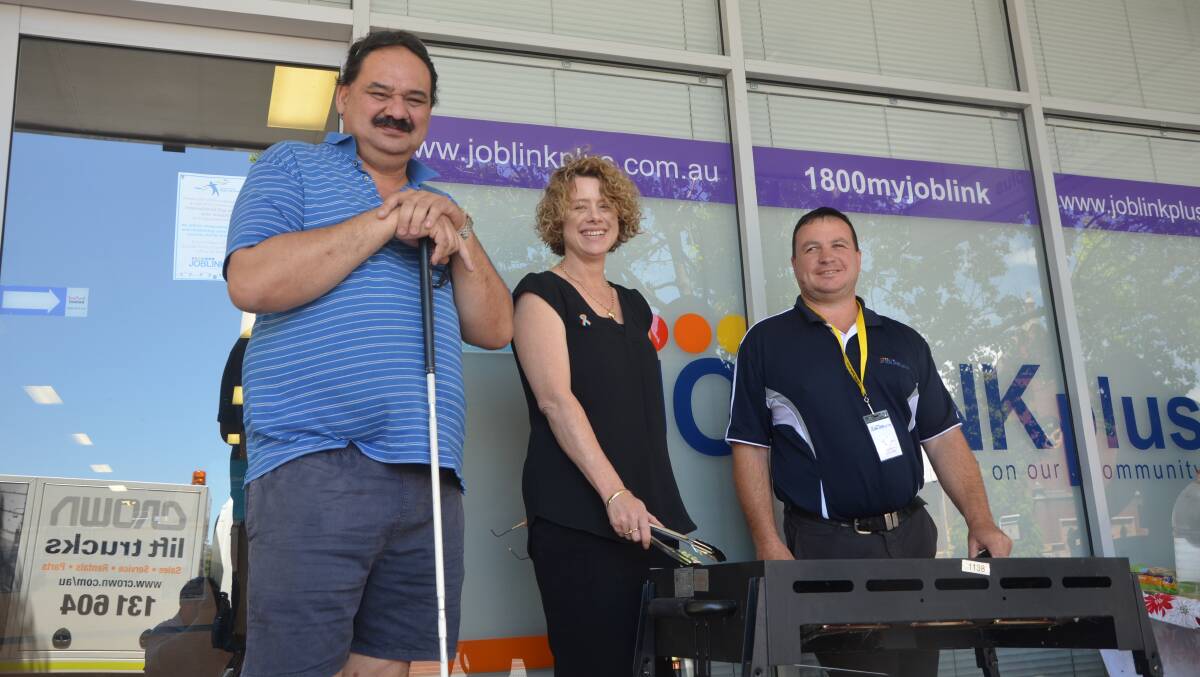 SIZZLING BARBECUE: Ross Pahuru, Joblink Plus DES manager Veronica Matheson and disability and community services manager Chris Buckman on Friday.