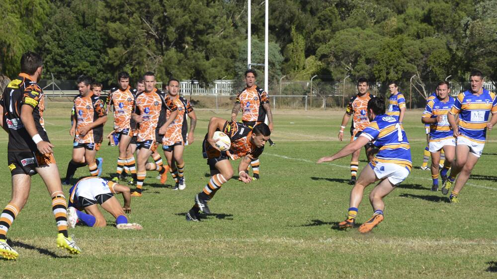 NO HALF MEASURE: Aberdeen Tigers playmaker Joey Griffiths darts through the Muswellbrook Rams defence at Olympic Park last Saturday.