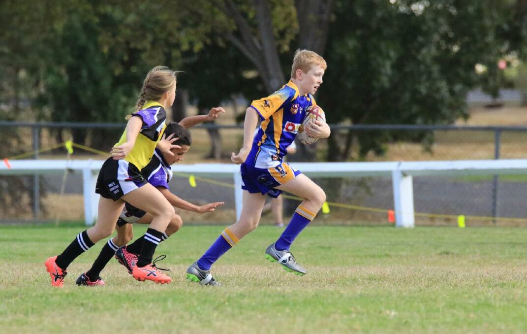 HARD RUNNING: Luke Marco leads the charge for the Muswellbrook under-10 Blues at Merriwa at the weekend.