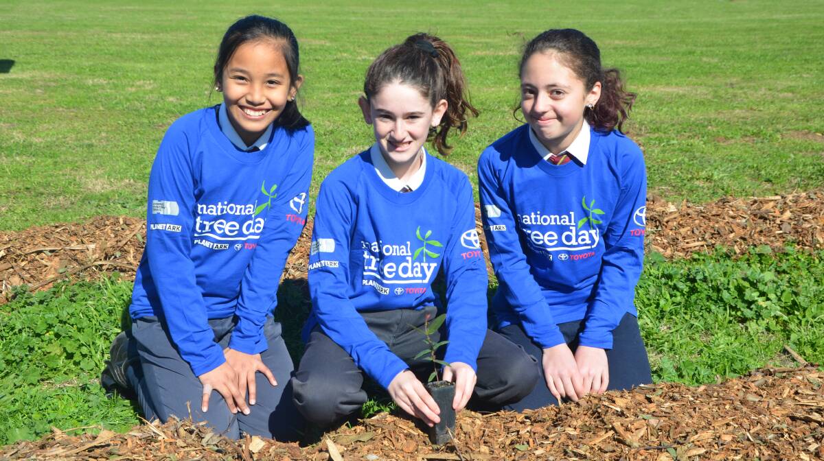 GREEN THUMBS: Year 6 students Pauline Estrada, L'tia Ross and Letanya Camilleri at St James' Primary School in Muswellbrook.