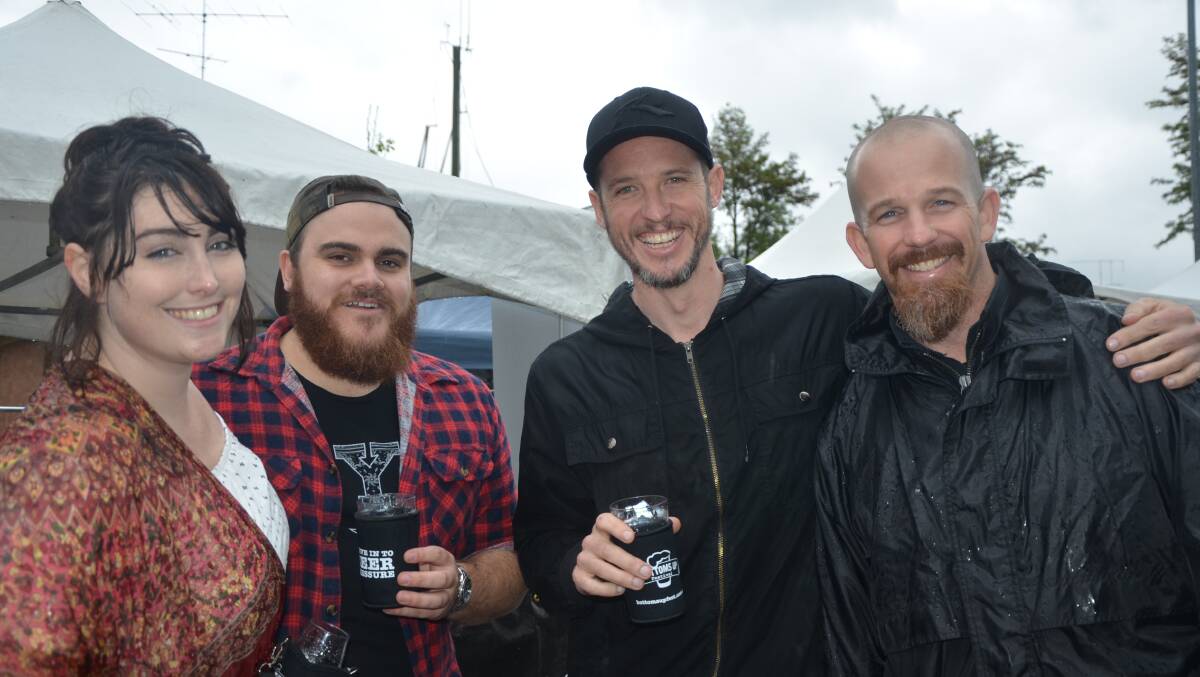 CHEERS: Brooke Munce, Jarrod Wilton, Jason Foy and Jason Troy at the Bottoms up Festival at Muswellbrook's Simpson Park on Saturday.