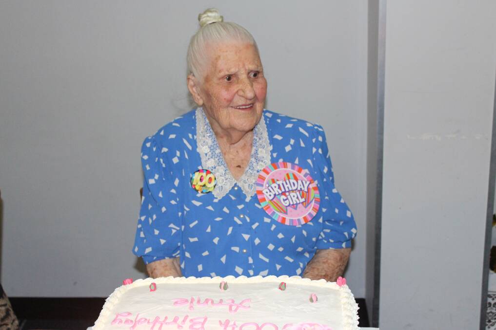 CONGRATULATIONS: Anne Wright with her cake celebrating 100 years.