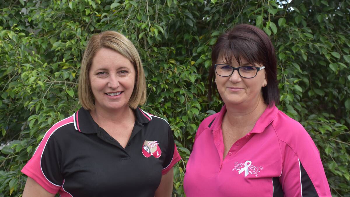 PINK: Muswellbrook RSL Club's Karen Egan and Kate Behsman in the present and past event polo shirts.