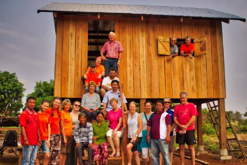 LIFE-CHANGING: The previous Cambodia team at one of the houses built during the trip.