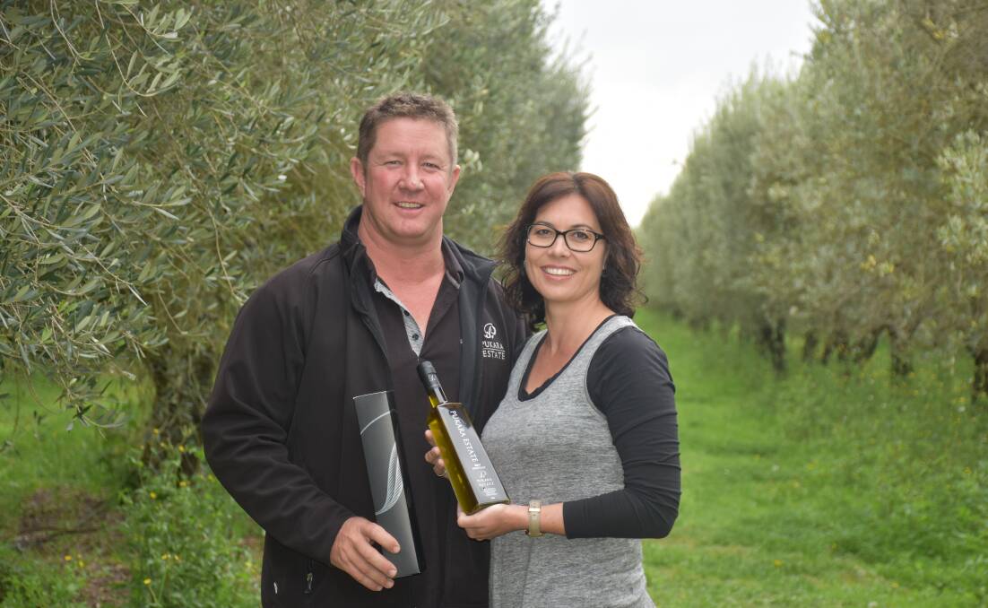 PROUD: Pukara Estate owners Steve and Racquel Goodchild with their 2017 Novello olive oil.