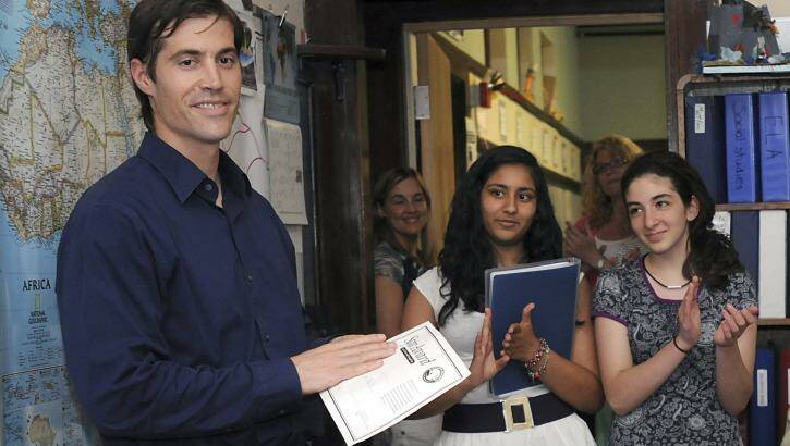 James Foley receives applause from students at the Christa McAuliffe Regional Charter Public School in Massachusetts in 2011. Photo: MetroWest Daily News/Ken McGagh