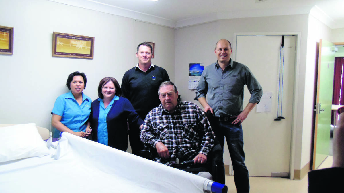 LIGHTENING THE LOAD: Front from left, carers Annie Barnett and Loretta Cruickshanks with resident Neville Walters and, back from left, Mangoola representatives Tony Israel and Ben Clibborn check out the new bed system. 
