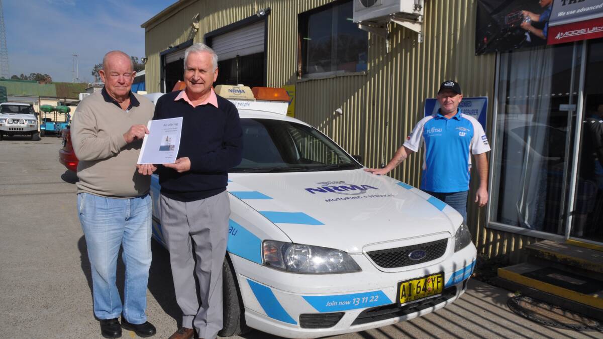 MOTORING IN: Muswellbrook Historical Society’s Brian Dever and Bill Spicer with their new book An Oily Rag: Muswellbrook Garages and Service Stations, and Zack Bennett from NRMA-approved Zack’s Automotive.