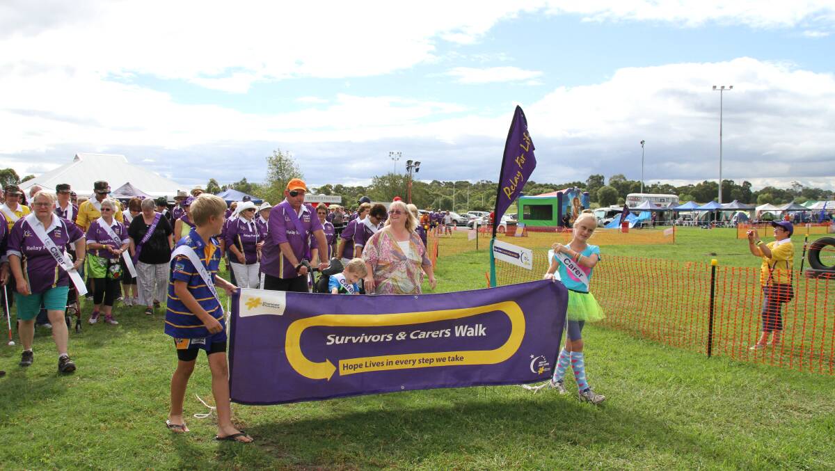 LEADING THE WAY: Muswellbrook Relay for Life was this year lead by the Ballard family from Muswellbrook. Lauchie, 12, Garry, Jake, 8, Mary and Jacinta, 12, showed the spirit of the event in their lap.