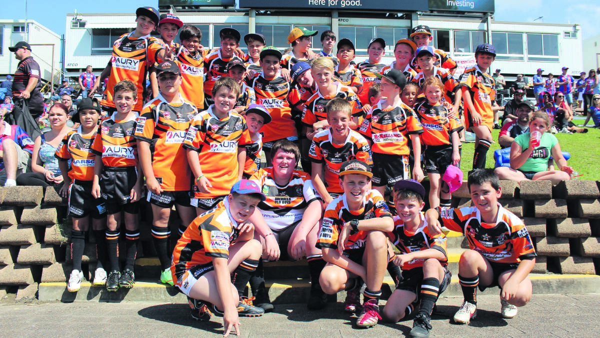 WE’RE THERE FOR YOU: Young members of the Aberdeen Tigers Rugby League Club threw their support behind respected local junior Alex McKinnon at the Newcastle Knights game last Sunday.