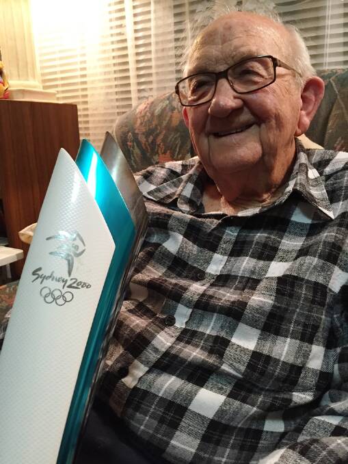 Bernie Budden with the Olypmic torch he was given after running his leg of the torch relay in August 2000, then aged 75.