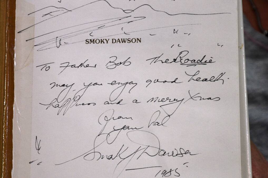 AUSTRALIA'S FIRST SINGING COWBOY: Smoky Dawson's inscription to Bob the Roadie in the inside cover of the book given to Bob as a Christmas present.