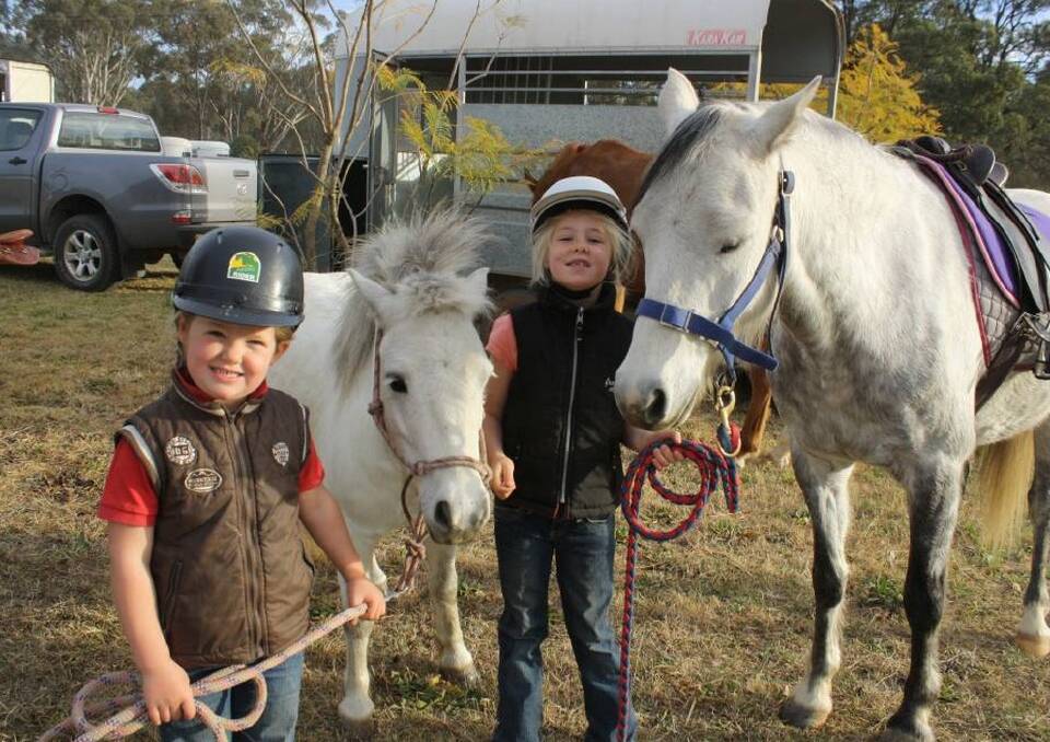 READY TO ROLL: Callie Hagan with Peter Pan and Addie Hagan with Chisel from Denman at the event last year preparing for their first Denman Charity Horse Ride.