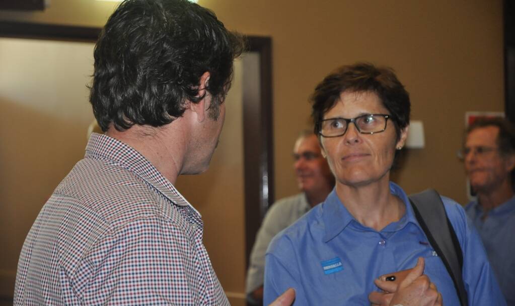 Bengalla GM, Jo-Anne Scarini, listening intently to a member of the audience at the PAC hearing in Muswellbrook on December 10, 2014.