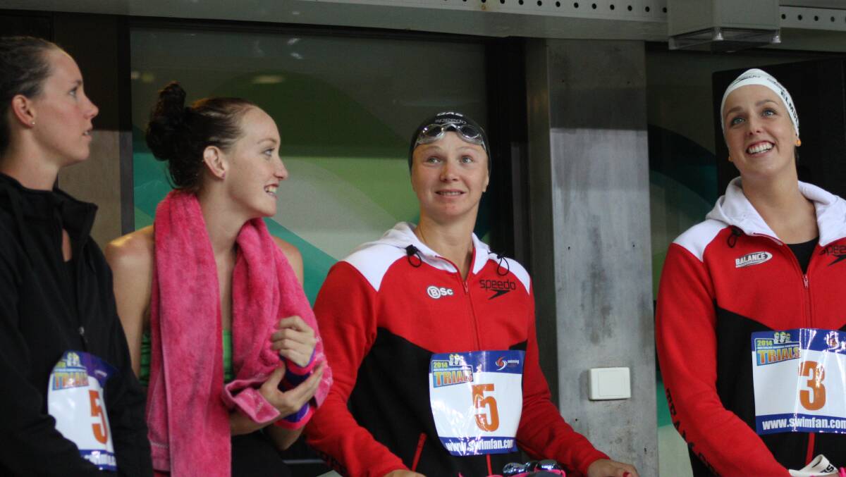 WAITING: Melanie Schlanger and Brittany Elmslie (at right) before the 50m freestyle semi final at the Australian Swimming Championships at Chandler. 
Photo: Chris McCormack