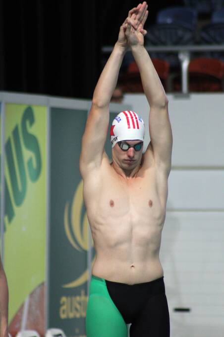 READY: Daniel Fox, of Chandler Swimming Club, warms up before winning his heat. 
 Photo: Chris McCormack