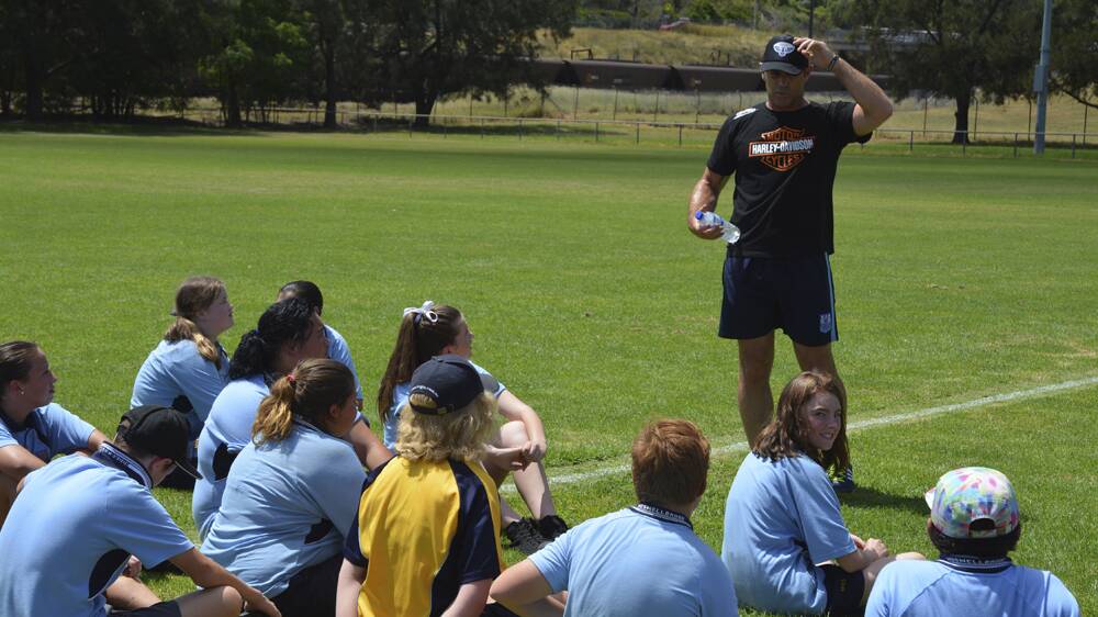TIPS FROM THE MASTER: Rugby league great Brad Fittler imparts some of his knowledge at Olympic Park, Muswellbrook, on Monday.