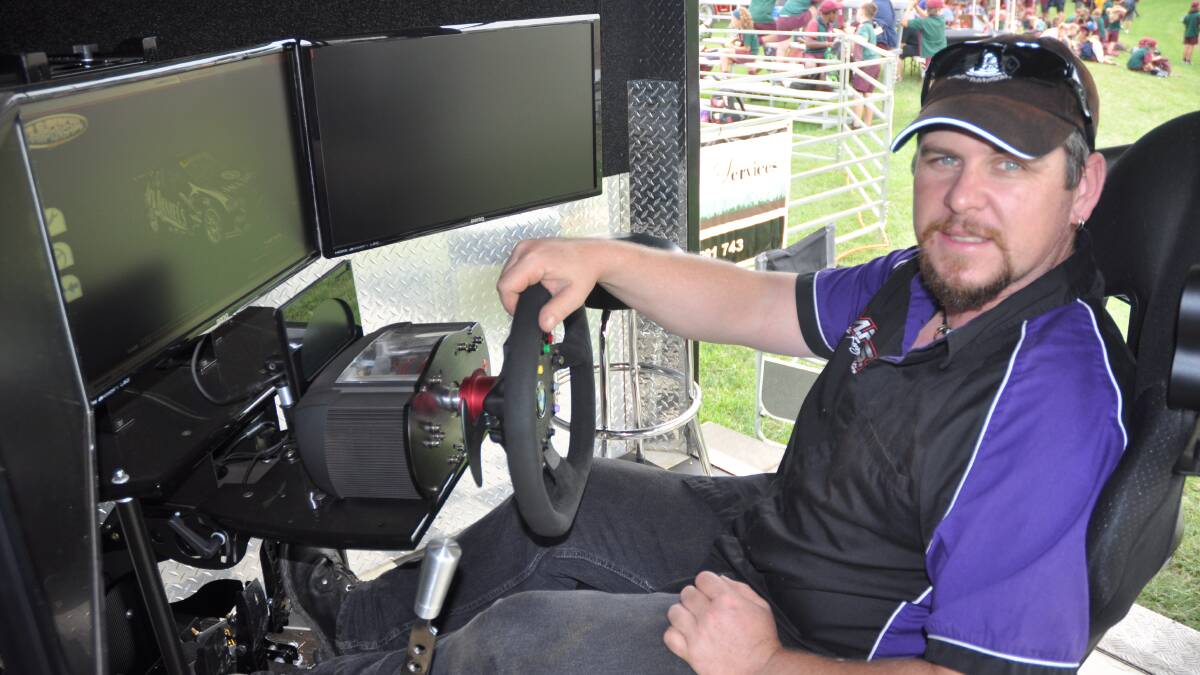 SHOW TIME: Motor Racing Simulator (MRS) owner Michael Skinner provides a demonstration at the Upper Hunter Show.