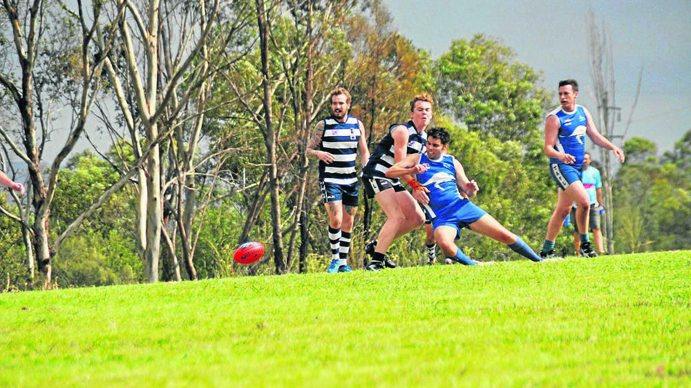 BATTLE: Muswellbrook Cats players Jake McCarthy and Matt Dunn compete for the ball against Tamworth on Saturday.