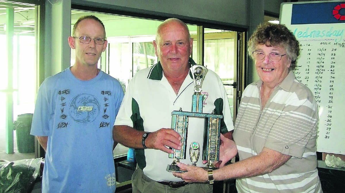 GREAT RESULT: Ossie Miles Trophy winner Rod Upton is presented with the trophy by Judy Miles and son Ian Miles at the Muswellbrook Golf Club.
