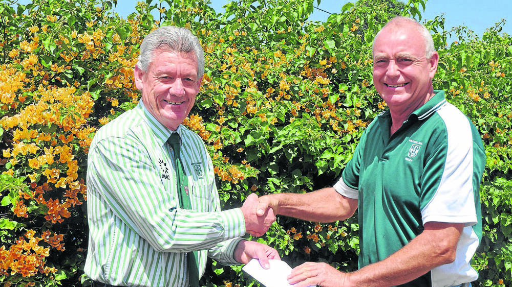 CONGRATULATIONS: Newly-appointed Muswellbrook Heelers Rugby Union Club vice-president Tim Pike (left) commends Mark “Gecko” Everingham on his life membership of the organisation.
