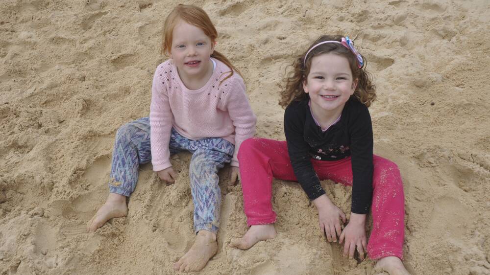 SHORE THING: Ellie Brochtrup, 3, and Ingrid Sears, 3, had fun in the sand.