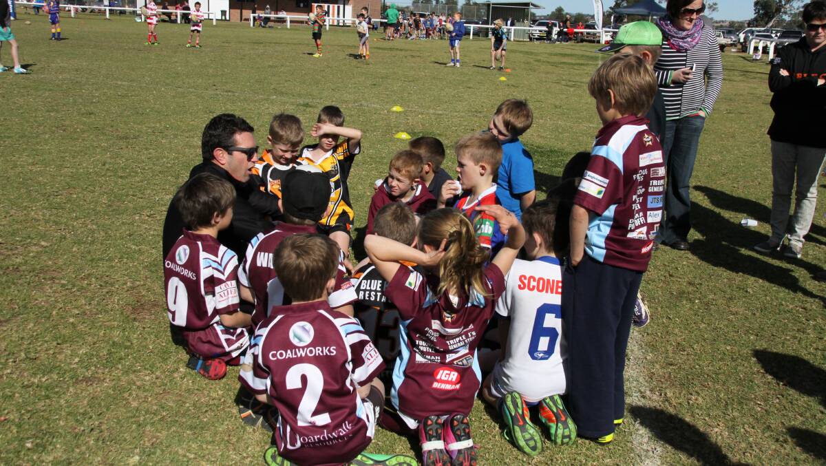 STAR STRUCK: Newcastle Knights legend Danny Buderus talks to a number of young players at an Aberdeen NRL clinic this week.
