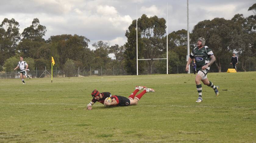 ICING ON THE CAKE: Singleton Bulls fullback Daniel Bates seals the win over the Muswellbrook Heelers at Highbrook Park on Saturday.