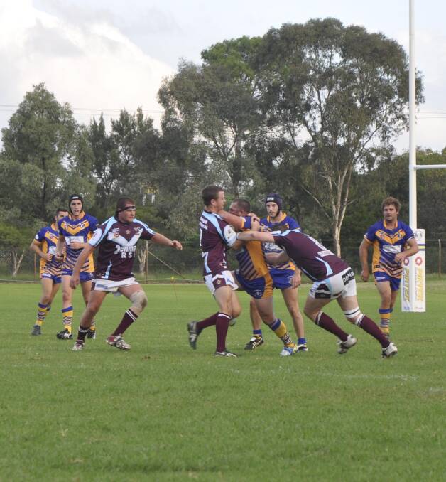 NO HALF MEASURES: Muswellbrook Rams playmaker Nathan Berry runs into a Denman brick wall at the weekend.