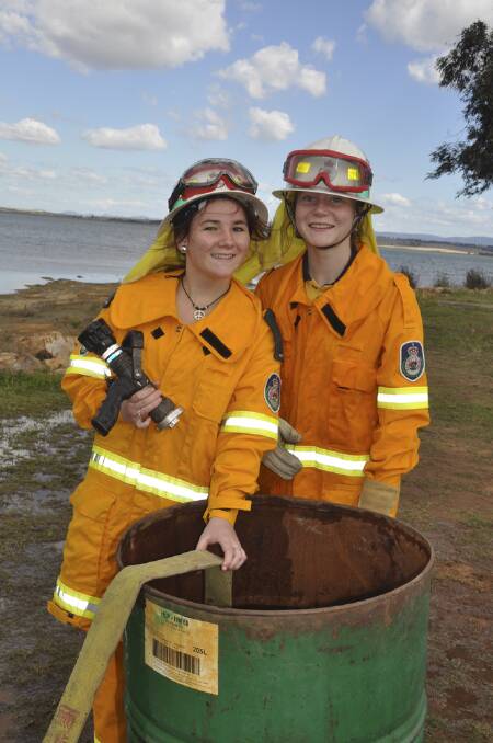 DRAFT PLAN: Muswellbrook High School students Rachel Cooper and Lauren Mitchell were part of Team Muswellbrook in a water drafting exercise on Wednesday
