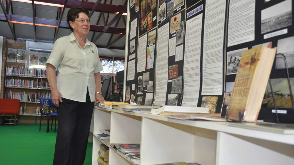 INTERESTING FACTS: Library officer Sue Aird with
 Aberdeen Library’s WWI display.