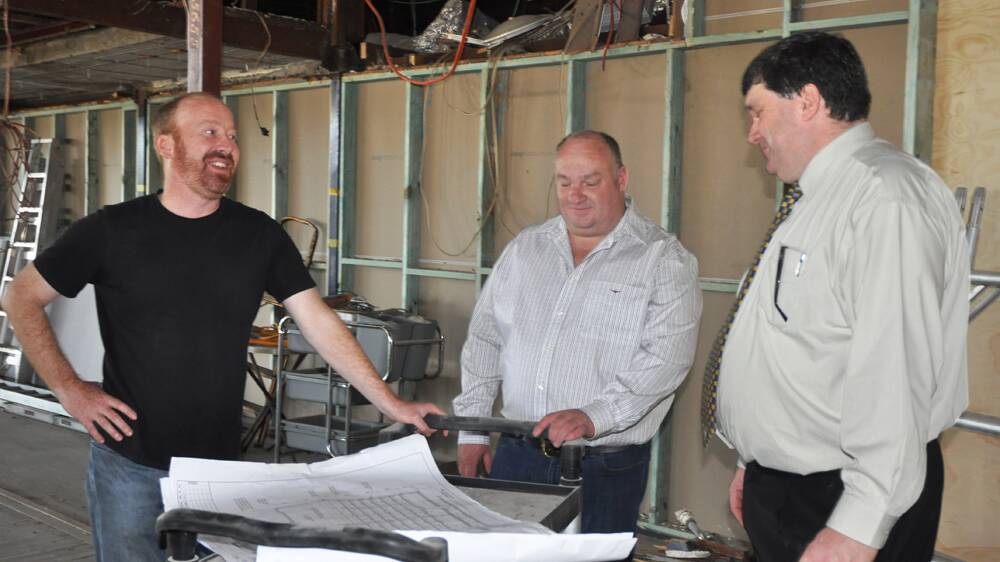 MILESTONE:  Mayor Martin Rush,  investor Michael Rinkin and Muswellbrook Workers Club general manager  Scott Bailey look at the plans for the new cinema.