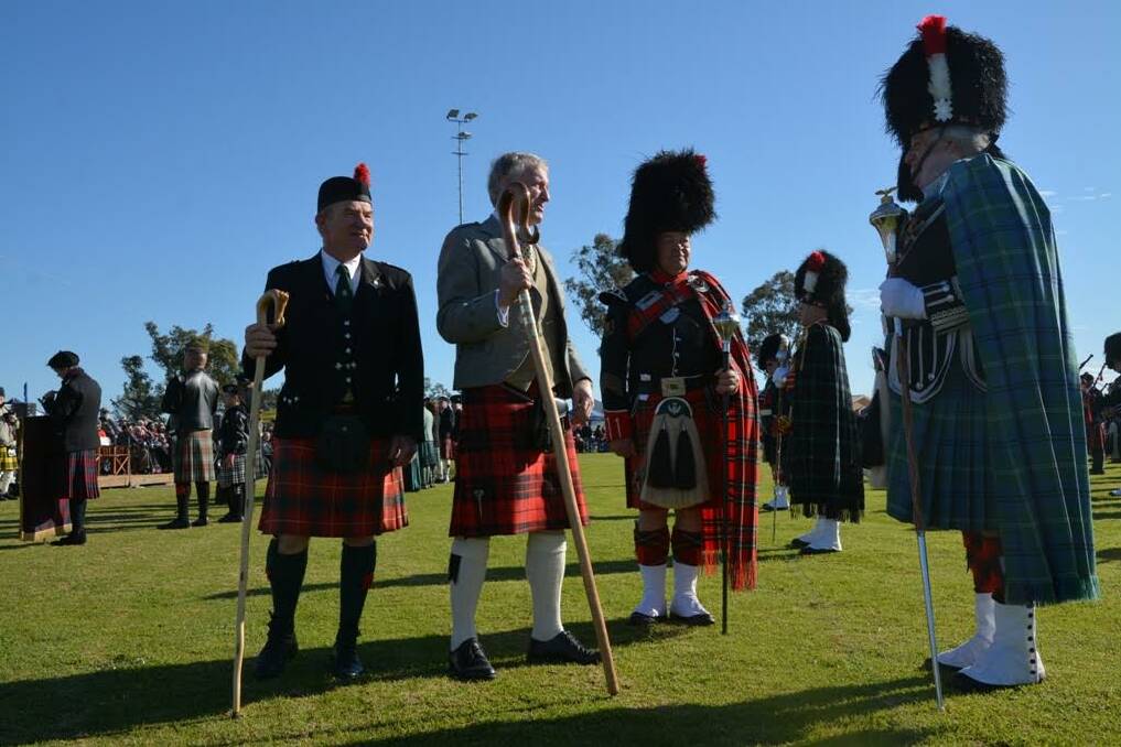 FUN TIMES: Acting president of the Aberdeen Highland Games Committee Charles Cook (left) with Chief of the Day John Macleod of Raasay inspecting the massed pipe bands at the 2015 Aberdeen Highland Games.