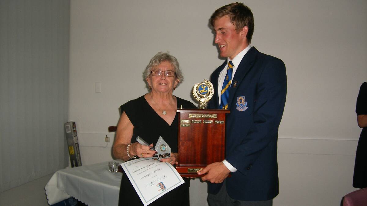 WELL DONE: Brock Matthews accepts his awards from Muswellbrook Lioness members Valerie McDonald.