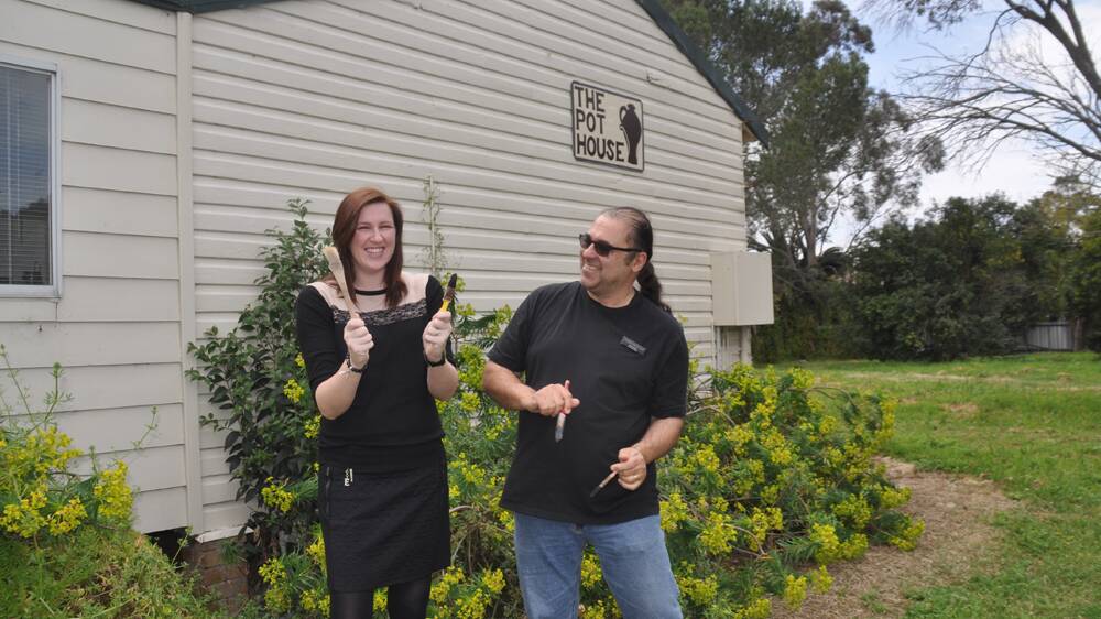 BRUSHED UP:  Muswellbrook Arts Centre education officer Elissa Emerson and centre manager Brad Franks ham it up in readiness for Saturday’s Creative Arts Fair at Lions Park, Lower Brook Street, home of The Pot House.