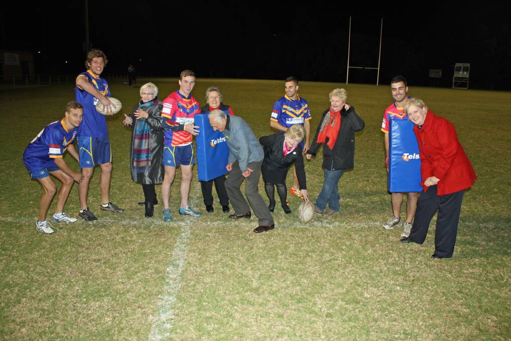 JULY: WORKING TOGETHER: Muswellbrook Senior Rams players Lenny Craft, Hayden Cunnen, Beau Dixon, Cade Boney and Marcus Bower with Muswellbrook Hospital Auxiliary president Sue Durham, CareLink volunteers Marie Wild and Les Gleeson, Auxilary secretary Eve Hulbert and treasurer Robyn Adnum and Muswellbrook Hospital maternity ward manager Janelle Alexander.