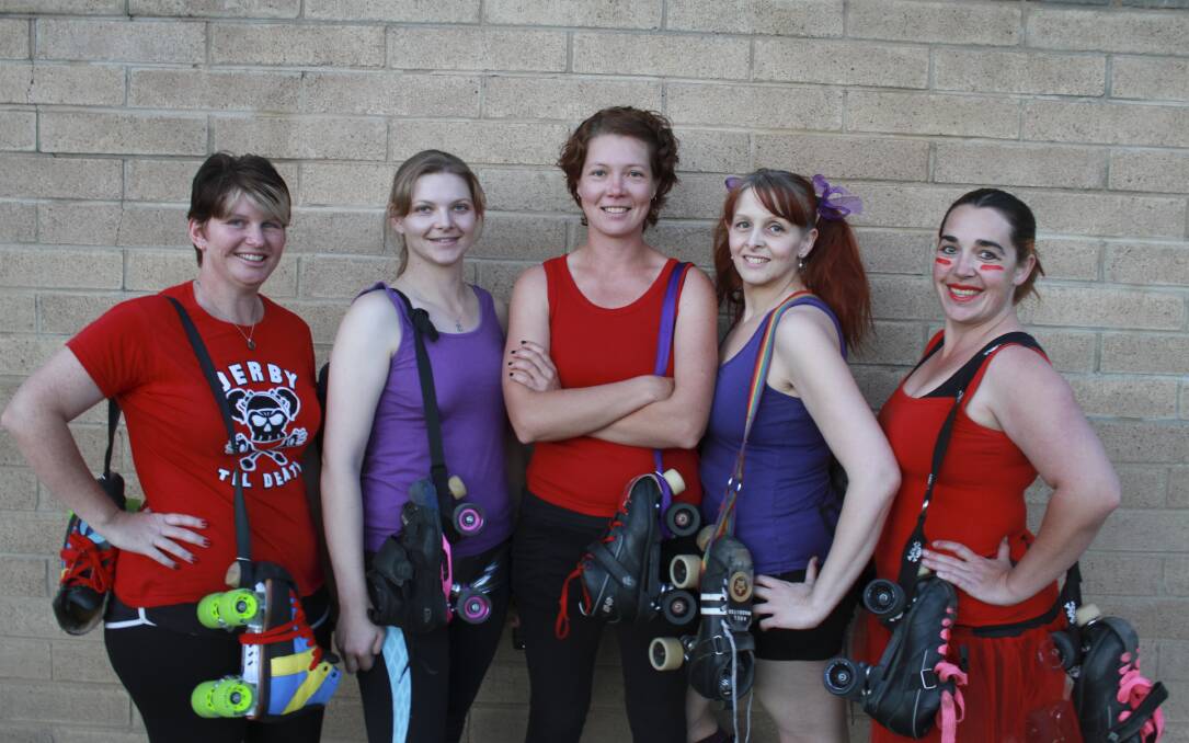 OCTOBER: EIGHTWHEEL ACTION: Valley Roller Girls making their roller derby debut at Carnivale on Wheels are Kelleigh Parker, Joann Williams, Rebecca Logue, Sandra Veigel and Kate Fleming.