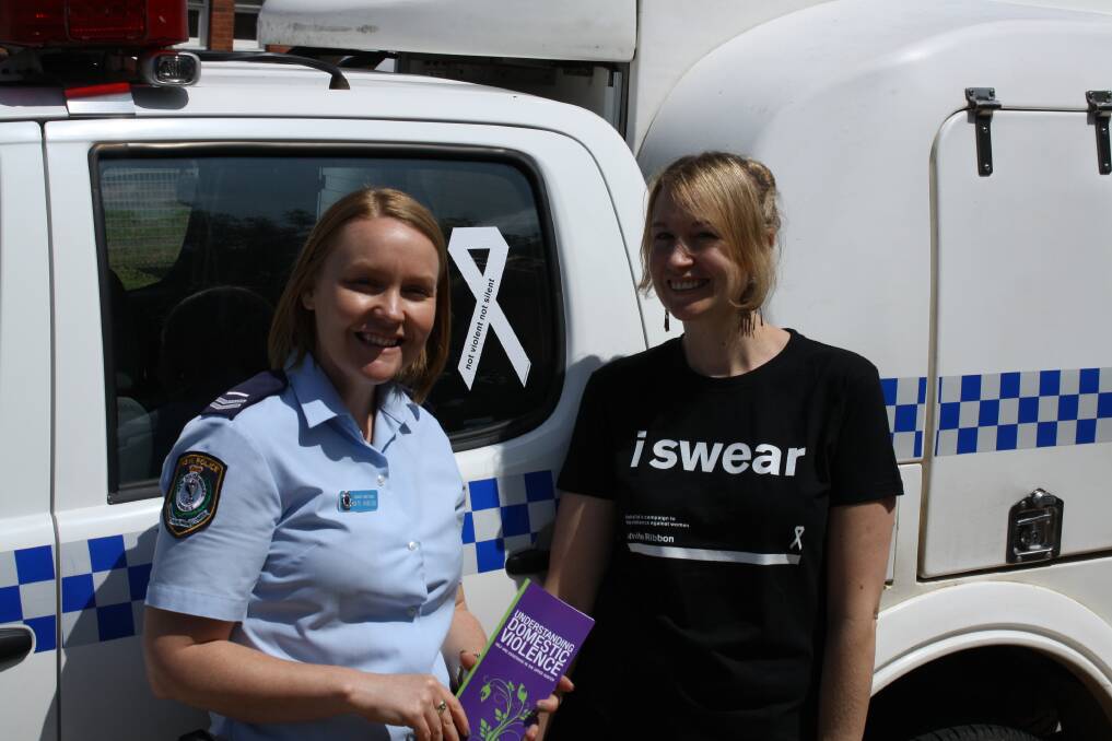 NOVEMBER: YOU’RE NOT ALONE:Police vehicles in the Hunter Valley Local Area Command have had white ribbon stickers placed on them in a show of support for the campaign. Pictured with one of the cars is Hunter Valley Local Area Command domestic violence liaison officer senior constable Kate Hobson and Muswellbrook Women’s and Children’s Refuge outreach case worker Eaowyn Leech.