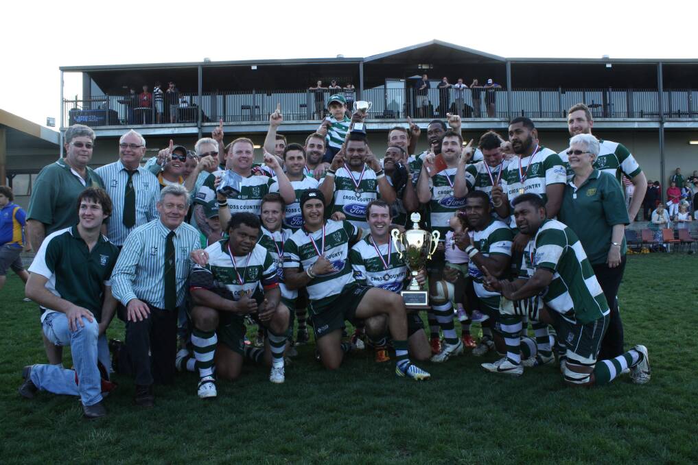 SEPTEMBER: WE ARE THE CHAMPIONS:Muswellbrook Heelers’ premiership-winning A grade side – Isaac Scholes, Simon Baxter, Mark Snow, Sikeli Votonisoga, Caleb Scholes, Chris Edwards, Bruce Rauqe, Josaia Besetimala, James Crowther, Mitchell Googe, Esava Ravouvou, Lywen Rapana, Sentiki Qata, Alan Johnson and Dylan Smith – celebrate with coaching staff and committee members after Sunday’s triumph.