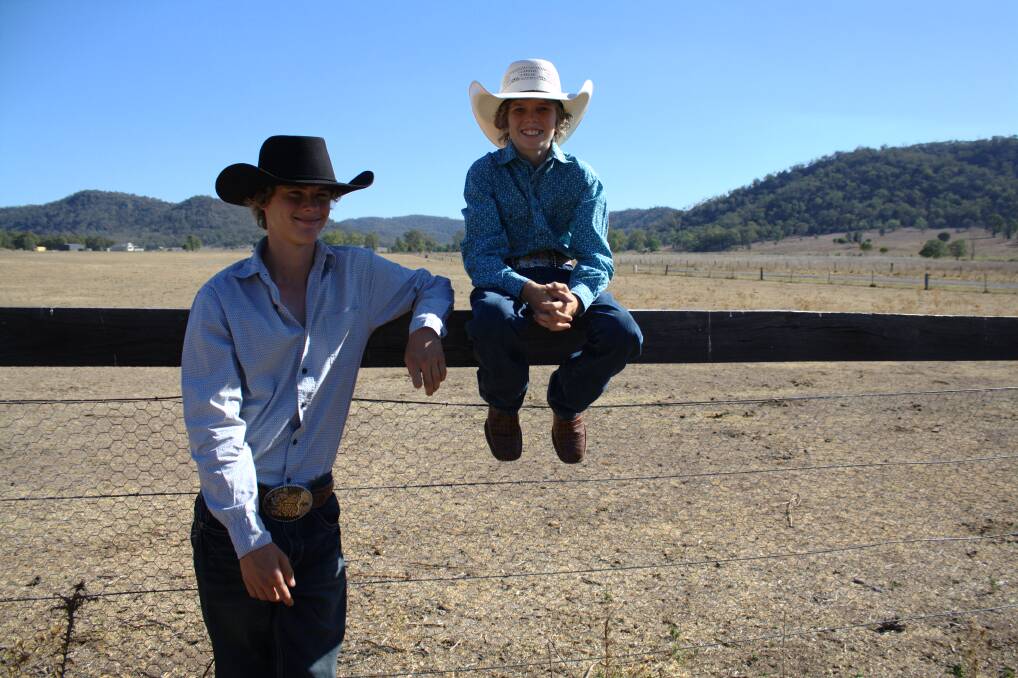 HIGH:Y-RANKED: Brent, 15, and Luke, 12, Parkinson at home after their success at the ABCRA National Finals Rodeo in Tamworth last weekend; and (inset) Luke Parkinson competes in the second round of the 11 to under-14 steer ride at the national finals. Pic: French's Rodeo Photos - www.rodeophotos.com.au
